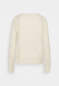 Elfenbensfärgad tröja, texturerad stickning, rundad halsringning, ribbade ärmslut och nederkant, långärmad, inga synliga knäppningar, enkel baksidesdesign.