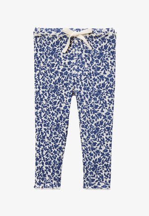 Leggings côtelés à motifs floraux blancs et bleus avec une taille élastique et un nœud de cordon beige à l'avant.