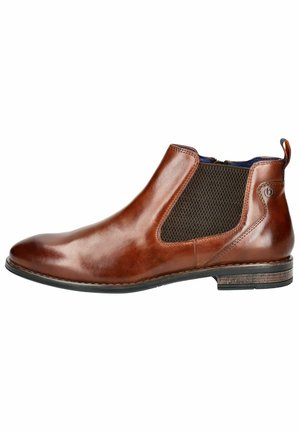 Bottines Chelsea en cuir marron avec panneaux latéraux élastiques, finition lisse, bout rond et talon texturé. Conception décontractée mais élégante.