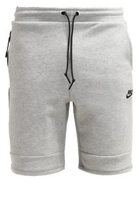 Gray cotton shorts with an elastic waistband, black drawstring, side pockets, and a black Nike logo on the left leg.