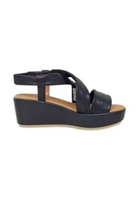 Sandali wedge in pelle nera con design a strisce incrociate, soletta imbottita e suola in gomma chiara. Piattaforma spessa per un'altezza aggiuntiva.