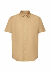 Chemise beige à manches courtes avec col classique et boutons sur le devant, présentée sur fond blanc.
