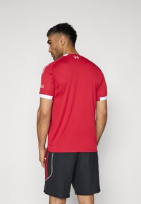 adidas Performance LIVERPOOL FC 25/26 HOME AUTHENTIC JERSEY - Article de supporter d'équipe de club - strawberry red