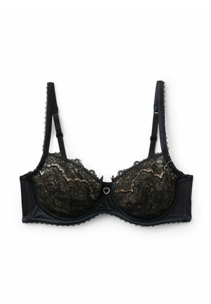 Černá krajková podprsenka s kosticí, průhledné krajkové košíčky, pás v saténovém vzhledu, nastavitelná ramínka, dekorativní srdcovitý kovový prvek uprostřed vpředu.