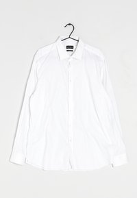 Wit langarm overhemd met knopen en een pointed collar, gemaakt van gladde stof, met een rechte snit en zachte plooien.