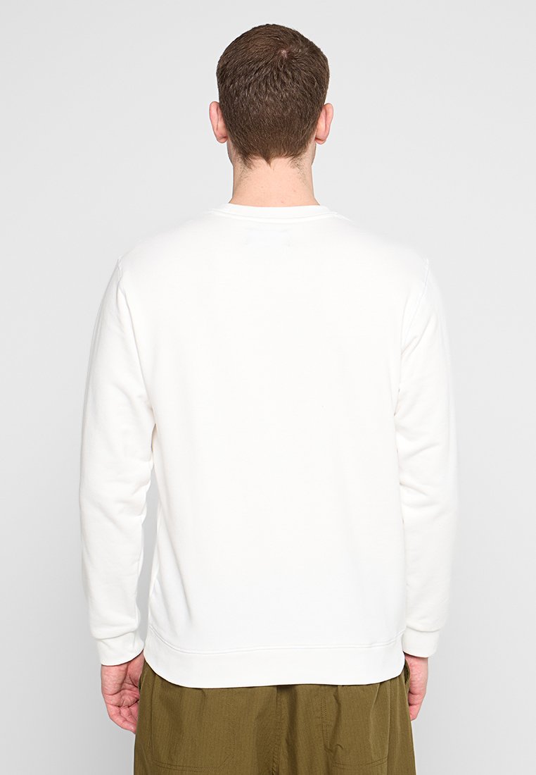 Witte sweatshirt met lange mouwen, ronde halslijn en ribgebreide manchetten. Minimalistisch ontwerp zonder zichtbare patronen of accenten.