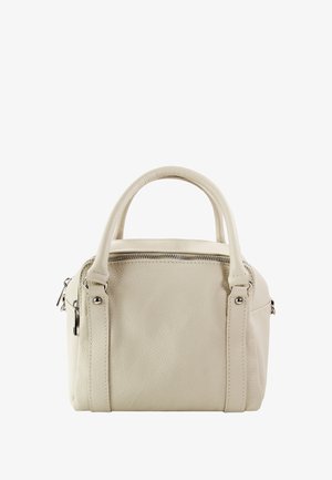 Kleine crèmekleurige leren handtas met twee korte handvatten, een ritssluiting en ritssluitingen aan de zijkanten. Getextureerd oppervlak met subtiele stiksel details.