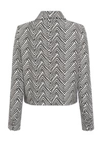 Gekürzte Jacke im schwarz-weißen Zickzackmuster; verfügt über einen Kragen und lange Ärmel mit Knopfdetails an den Manschetten.