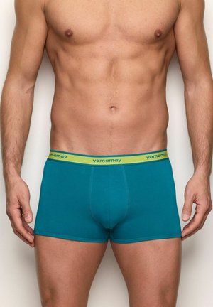 Boxer in cotone color verde acqua con elastico in vita verde con il logo "yamamay". Texture liscia, design aderente e lunghezza a metà coscia.