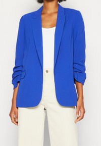 Marks & Spencer Kort kappa / rock - blue