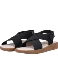 Svarta sandaler med korsade remmar, justerbara spännen och en korktexturerad sula. Lättviktsdesign med en platt sula för komfort.