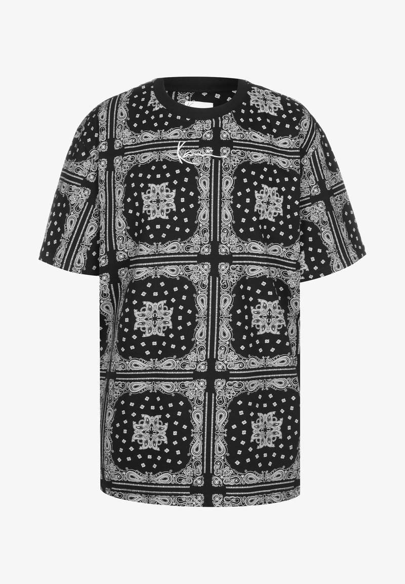Černobílé oversized tričko s paisley a diamantovým vzorem, kulatým výstřihem a krátkými rukávy, vyrobené z hladké bavlny.