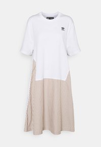 Puuvillane T-särgidress, millel on valge ülaosa ja beežiriba allosa. Lühikesed varrukad, ümmargune kaelus ning mugav lõtv sobivus.