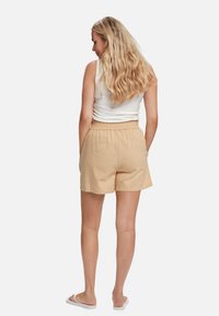 U.S. Polo Assn. CORNELIA PAPERBAG - Tepláky - ginger root