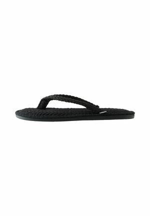 Black braided fabric flip-flop sandal with textured sole and thong strap, shown from the side on white background.