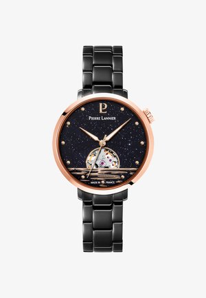 Black stainless steel watch with a black starry dial, rose gold accents, transparent case back, and a round face with minimalist features.