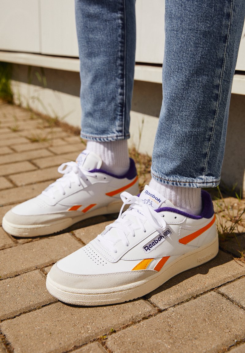 purple and white reeboks