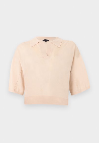 Haut en maille beige clair à manches courtes avec col et encolure en V, ourlet court, présenté sur un fond uni.