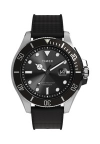 Timexi must sukeldumiskell roostevabast terasest korpusega, musta tekstuuriga rihma, helendavate märgistuste, pöörleva raamiga ja kuupäevakuvariga; veekindel kuni 100 m sügavuseni.