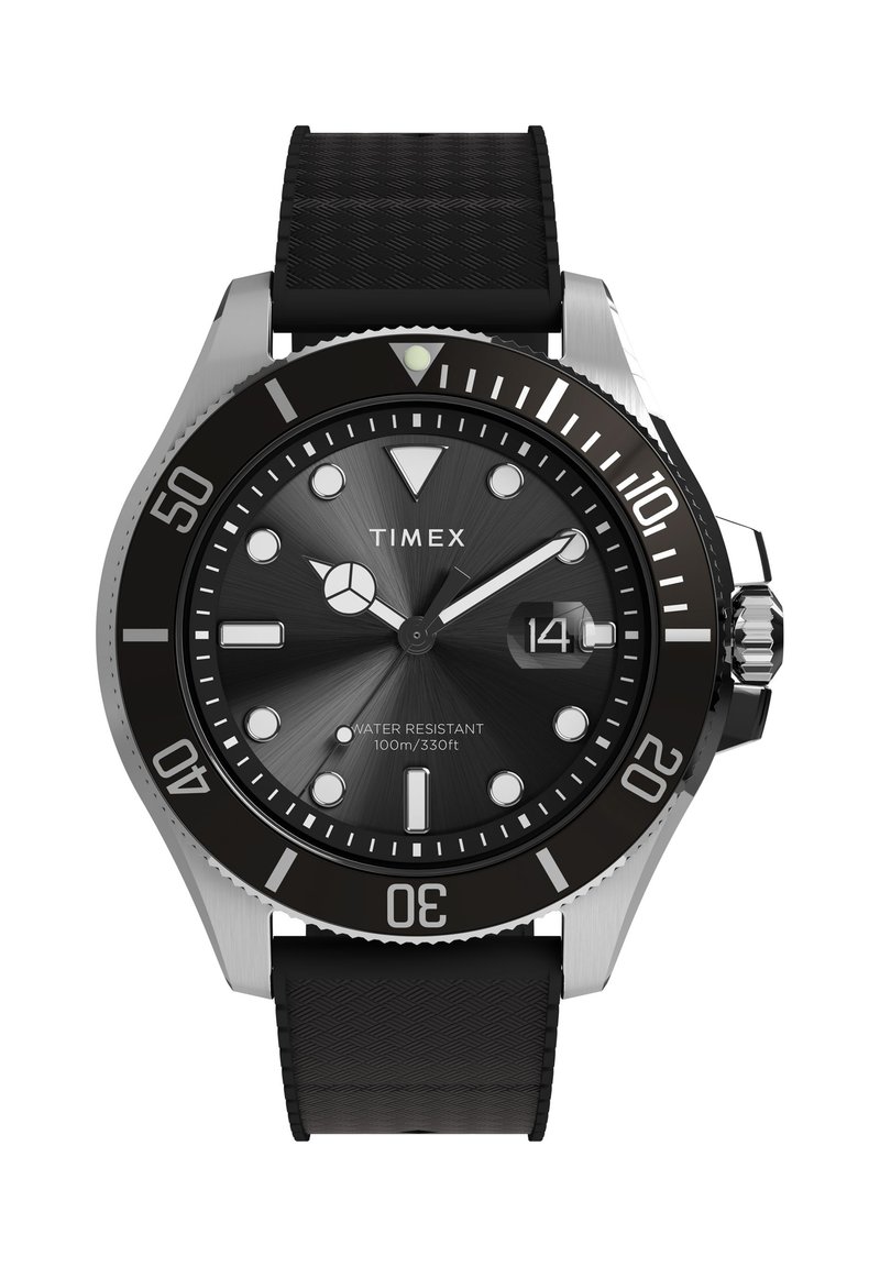 Timexi must sukeldumiskell roostevabast terasest korpusega, musta tekstuuriga rihma, helendavate märgistuste, pöörleva raamiga ja kuupäevakuvariga; veekindel kuni 100 m sügavuseni.