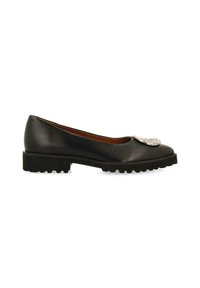 Des ballerines en cuir noir avec un bout arrondi, embellies d'un accent décoratif de couleur argentée à l'avant, et une semelle en caoutchouc texturée.