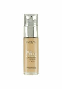 L'Oréal Paris True Match-foundation i en genomskinlig glasflaska med en silverpump. Ljusbeige färg, märkt 3.R/3.C, super-blendbar formel.