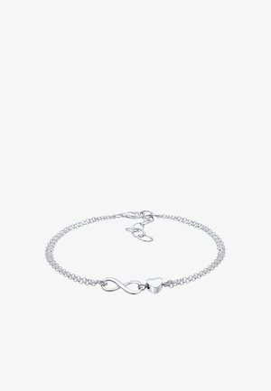 Ezüst karkötő finom lánccal, végtelen jel és szív medállal díszítve. Egyszerű kialakítás, polírozott felülettel és állítható kapoccsal.
