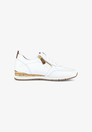 White sneaker with lace-up front, side gold zipper, brown leather accents, cork and gold detailing on sole, and beige treaded outsole.