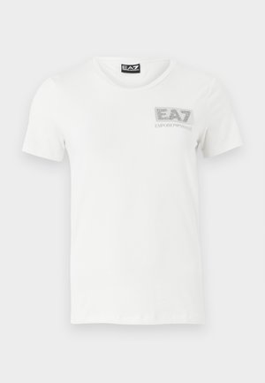 T-shirt bianco in cotone con maniche corte, scollatura rotonda e logo EA7 in tono argento sull'area sinistra del petto. Texture liscia, vestibilità casual.