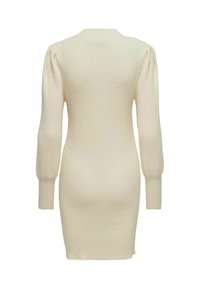 Abito in maglia color crema con maniche lungo a sbuffo, texture a coste, silhouette aderente e scollo rotondo.