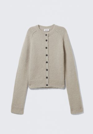 Beige knitted cardigan with long sleeves, round neck, ribbed cuffs and hem, and a central row of black buttons. Label reads "WEEKDAY."