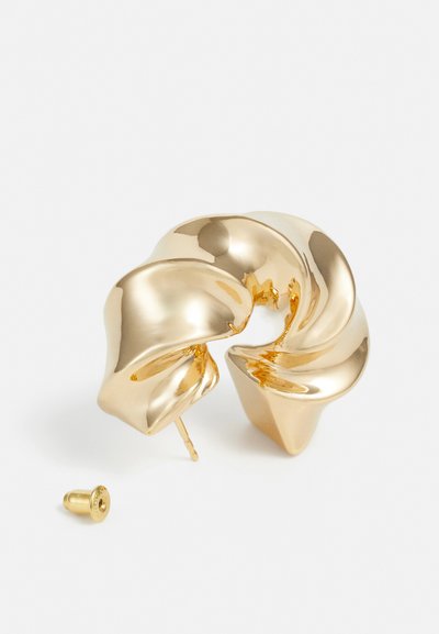 Gold-toned metal earrings with a sculptural, swirled design, featuring a smooth, reflective surface and a post back closure.