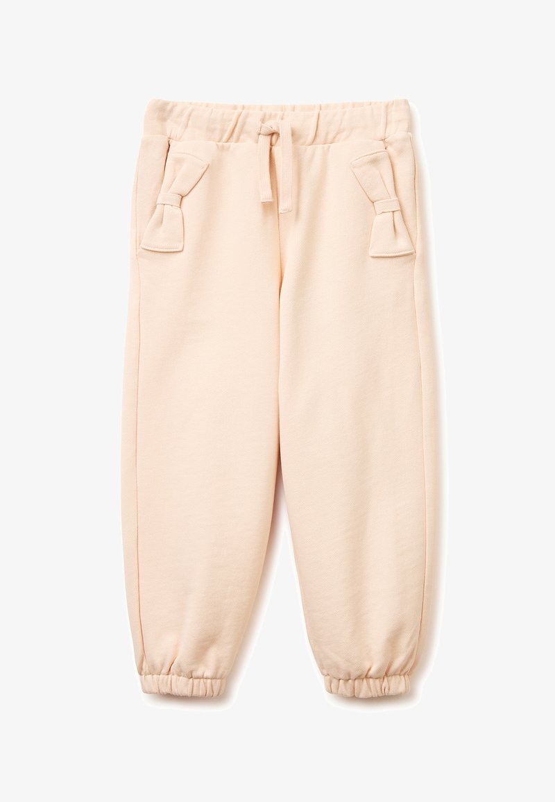 Beige joggingbroek voor kinderen met een elastische tailleband en boorden, zijzakken versierd met stoffen strikjes en een voorste trekkoord.
