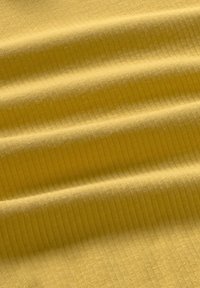 Ribbed fabric in a soft yellow hue, featuring a smooth texture with prominent vertical lines and gentle waves across the material.