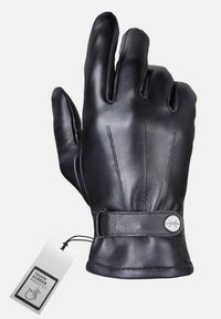 Zwart lederen handschoen met een gladde textuur, waarbij drie vingers zichtbaar zijn. Inclusief een polsbandje en een label gemarkeerd met "Touch Screen Proofed."