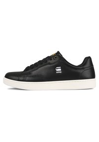 Black leather sneaker with a smooth texture, white rubber sole, and black laces. Features embroidered logo on the side and subtle stitching details.