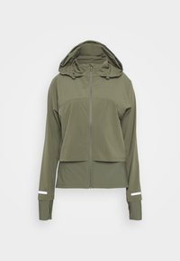 Olivgrön jacka med croppad design, hel dragkedja, justerbar huva och långa ärmar med reflexaccentstripes vid manchetterna.