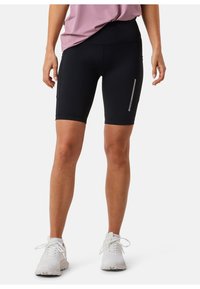 Sorte atletiske shorts med høj talje, der har en sidelomme med lynlås og en reflekterende detalje, lavet af strækbart materiale.