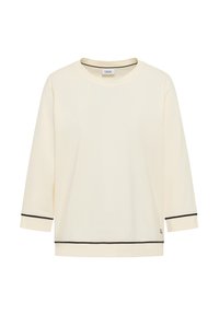 Kremowa koszula z długim rękawem, z czarnymi wykończeniami na mankietach i dolnym brzegu, okrągły dekolt oraz metka marki "Cecil" wewnątrz kołnierza.