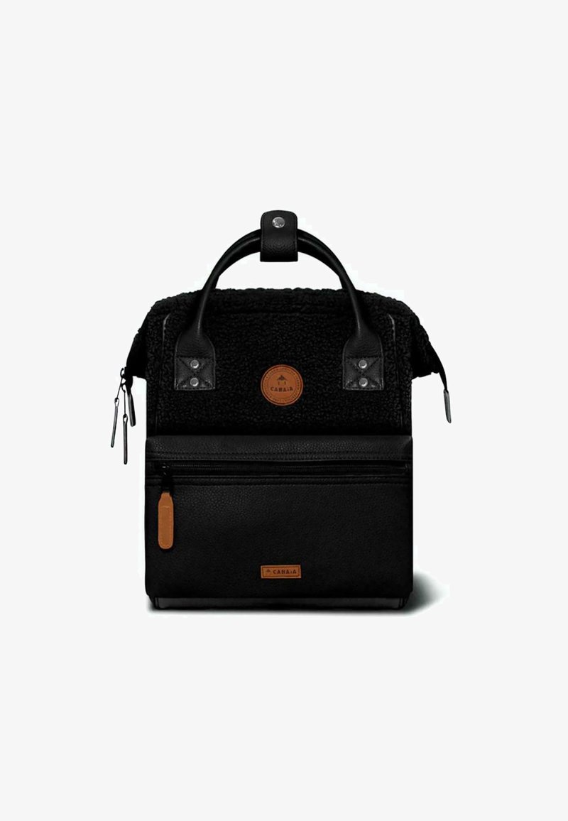 Black backpack with textured top section and smooth black leather bottom. Features dual handles, logo patch, and a front zippered pocket.