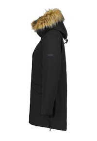 Parka invernale nera con cappuccio bordato di pelliccia, maniche lunghe, zip laterale e ampi tasconi frontali, vista di lato.