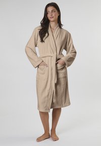 Beige bathrobe made of soft terry fabric, featuring long sleeves, a belted waist, and two front pockets. Simple, classic design.