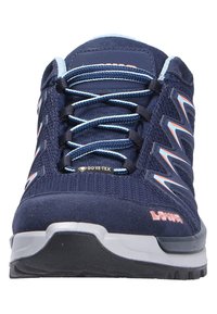 Navy blue hiking shoe with a textured mesh upper, light blue laces, and grey rubber sole. Features GORE-TEX branding on the side.