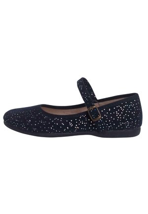 Black suede ballerina flats featuring a shiny, scattered glitter pattern, a rounded toe, and an adjustable strap with a small buckle.