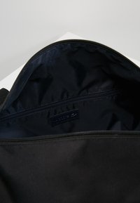 Lacoste ROLL BAG - Sports bag - black