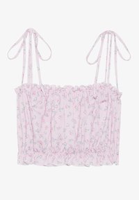 Crop top rose à fleurs avec ourlet volanté et bretelles spaghetti ajustables, présentant un tissu léger et texturé ainsi que de petits motifs floraux.