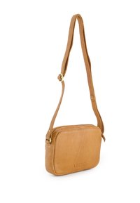 Tan leather crossbody bag with a rectangular shape, thin adjustable strap, and a zippered closure. Features embossed branding on the front.