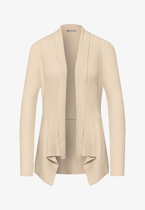 Cardigan côtelé beige à ouverture frontale, manches longues et ourlet asymétrique, confectionné en tissu tricoté doux.