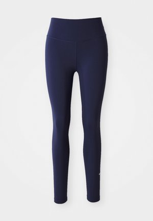 Legginguri fără cusături de culoare navy, cu o talie înaltă, fabricate dintr-un material elastic. Prezintă un logo subtil pe piciorul inferior, cu o textură netedă pe întreaga suprafață.