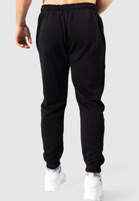 Smilodox TAYLOR - Trainingsbroek - schwarz